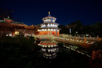 China temple and reflective pool at night