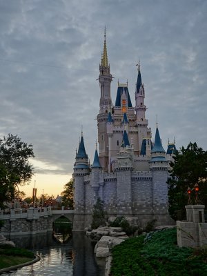 Castle with setting sun and cloudy skies