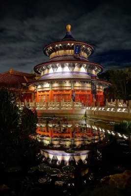 Chinese temple at night with reflecting pond