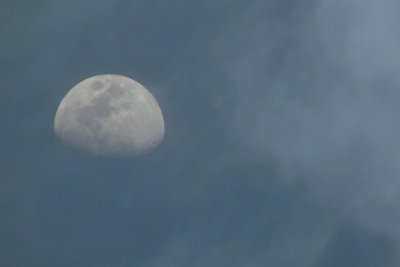 Moon and clouds at dusk