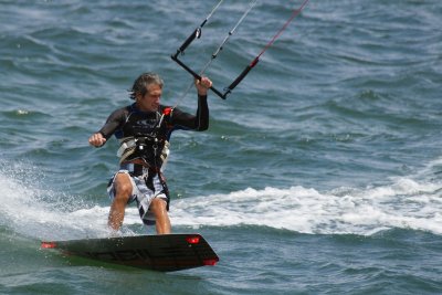 Kite boarder cutting a turn