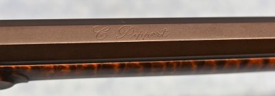 Makers name on top barrel flat