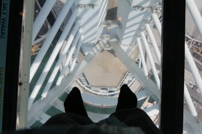 My feet on a pane of glass 300 feet above the ground.