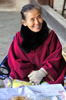 An Happy Temple Saleswoman