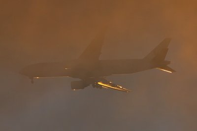 JALs' B-777/200 Landing Through Sunset Clouds