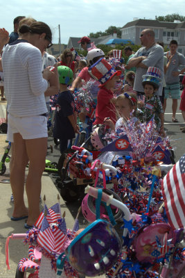 11.  Kids with dressed bikes line up for the annual July 4th bike parade.