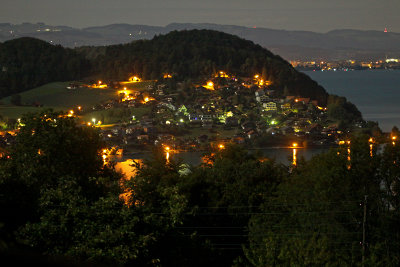 Looking west towards Faulensee village in the night with moonlight at 3:30 a.m.