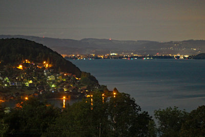 Looking west towards Faulensee village in the night with moonlight at 3:30 a.m. - Towns of Gwatt and Thun in the background