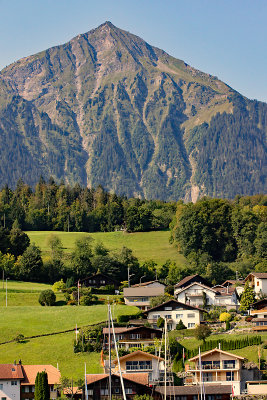 Part of the village of Faulensee with Mount Niesen in the background