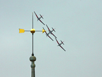 Four PC-7s in formation behind the wind indicator on top of the curch tower of my village