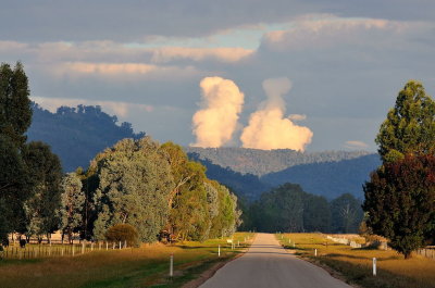 On the way home, the road from Benalla to Myrrhee.  White clouds are probably from controlled burns.