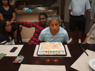 Birthday girl blowing her candles