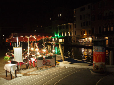 A restaurant by a canal in Venice