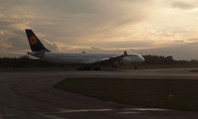 Lufthansa A340-642 lines up for takeoff from Munich at sunset