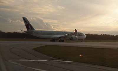 Qatar Airways A350-941 in the setting sun