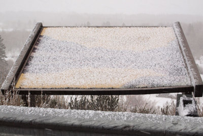Wayside sign covered with snow