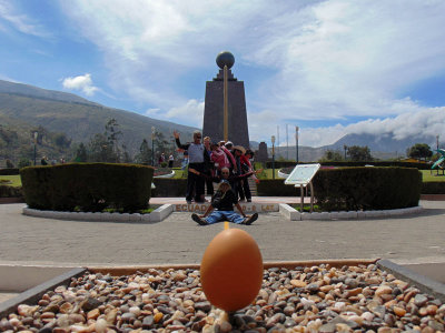 Balancing an egg along the equatorial line outside of Quito