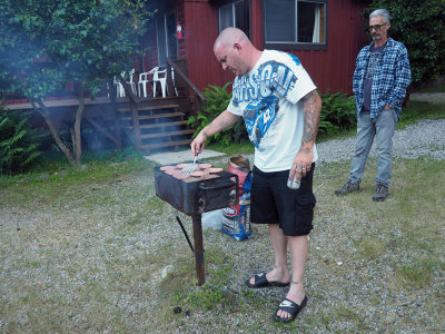 Grilling for the barbecue the evening before the event