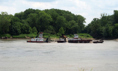 A workboat of some kind with a barge pusher on the Missouri river near St. Louis