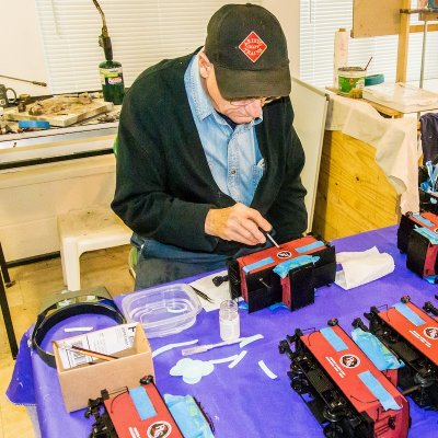 Ed applying a decal to a model caboose.