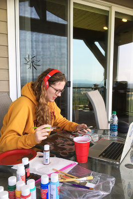 Zoe painting & relaxing on the deck