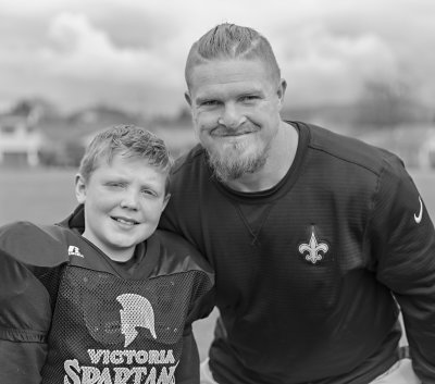 Andrew with NFL New Orleans Saints Adam Bighill (#99) during the Cowichan Football Camp he runs. March 18, 2018 (9 years old)