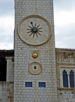 15th Century Dubrovnik Clock Tower shows hours in Roman Numerals and minutes in Western Numerals