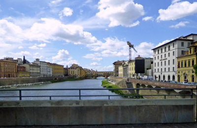 Crossing the Arno River in Florence with Ponte Vecchio in the background