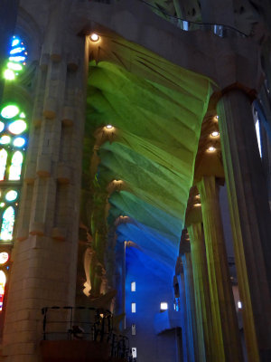 Cool color reflections from Stained Glass on the ceiling in the Sagrada Familia