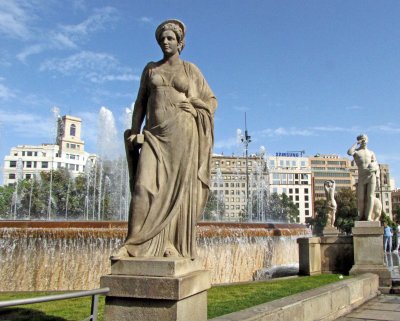 Statues around a fountain in Placa de Catalunya