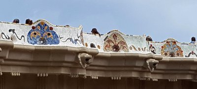 Mosaic aquatic animals on the outside of the lower court, and lion heads are part of the drainage system
