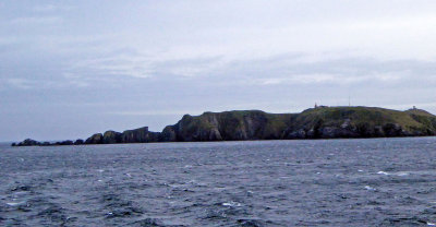 First look at Hornos Island with the Cape Horn Lighthouse and Memorial on Top