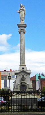 Column beside the Cathedral of Punta Arenas is topped with Maria Auxiliadora (Mary, Help of Christians)