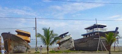 Boats on Tarqui Beach in Manta, Ecuador, needing refubishment