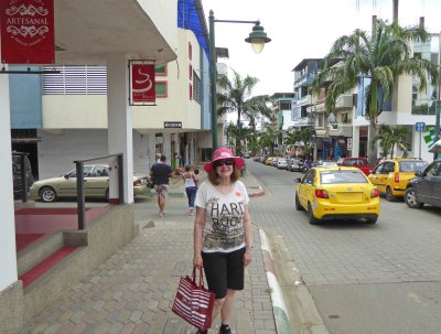 Susan on the street of Montecristi, Ecuador, with her new hat