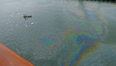 Figured out they are using Absorbent Pads to clean an Oil Slick