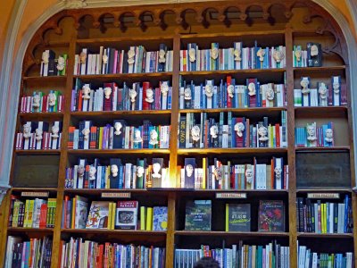The second floor of Livraria Lello Bookstore includes busts of famous Portuguese writers