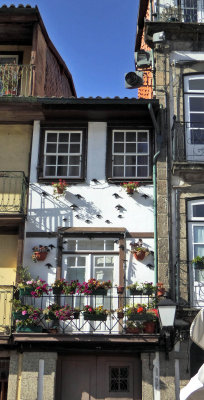 Narrow house in Oliveira Square in Guimararaes