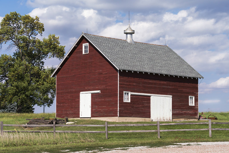 It is hard to find a well kept old barn. Today's machinery is just so much bigger than a team of horses or mules.

An image may be purchased at http://edward-peterson.pixels.com/featured/red-barn-on-a-cloudy-day-edward-peterson.html?newartwork=true