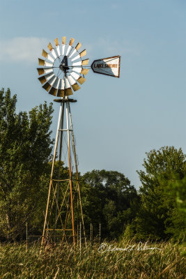 Looking close at this windmill and you will see that the pump has been pulled and is leaning on the inside of the structure.

An image may be purchased at http://edward-peterson.pixels.com/featured/windmill-pump-out-edward-peterson.html?newartwork=true