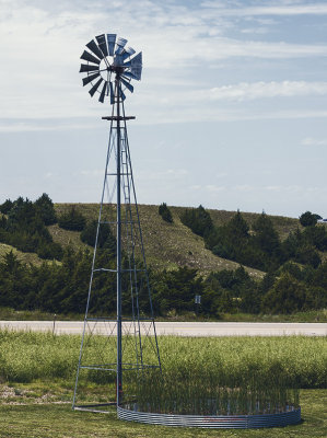 On a trip to western Nebraska for golfing I found this windmill and stock tank with a nice red hand pump. It takes a lot of land to graze cattle and water is a key component in the raising livestock.

An image may be purchased at http://fineartamerica.com/featured/western-nebraska-windmill-edward-peterson.html?newartwork=true