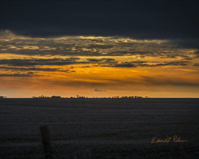 Another Midwest Christmas day comes to a close. Family, friends and relatives have been visited, gifts exchanges, hugs had and a meal or two eaten. On the drive home the clouds begin to clear allowing for a brilliant sunset.

An image may be purchased at http://edward-peterson.pixels.com/featured/christmas-day-sunset-edward-peterson.html