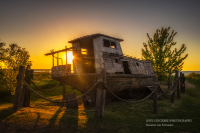 Old fishing boat at sunset