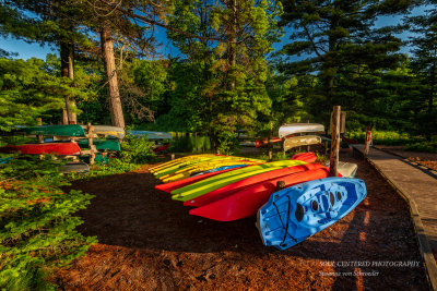 Kayaks and canoes in morning light