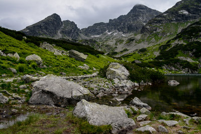 Green Lake Gasienicowy 1672m in Gasienicowa Valley, behind Koscielec 2155m and Swinica 2301m on the right, Tatra NP