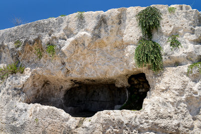 The ancient catacombs above the Greek Theatre, Neapolis Archaeological Park in Siracusa