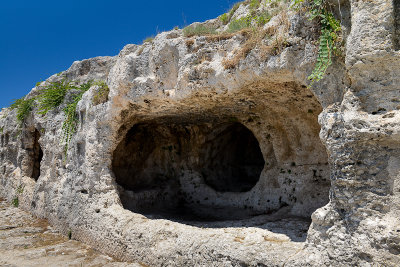 The ancient catacombs above the Greek Theatre, Neapolis Archaeological Park in Siracusa