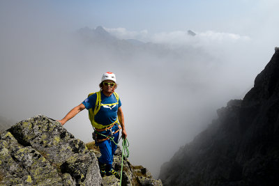 Grzesiek on Gerlach massif descending to Velická Valley, far behind Lomnický Peak 2634m, Tatra NP