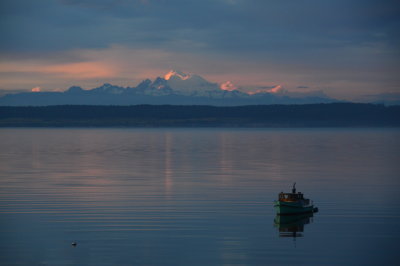Mt. Baker at twilight; boat is on Penn Cove