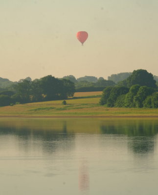 A  red  balloon ,reflected in Bewl  Water